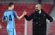 SUNDERLAND, ENGLAND - MARCH 05:  John Stones of Manchester City (L) and Josep Guardiola, Manager of Manchester City (R) embrace after the Premier League match between Sunderland and Manchester City at Stadium of Light on March 5, 2017 in Sunderland, England.  (Photo by Michael Regan/Getty Images)